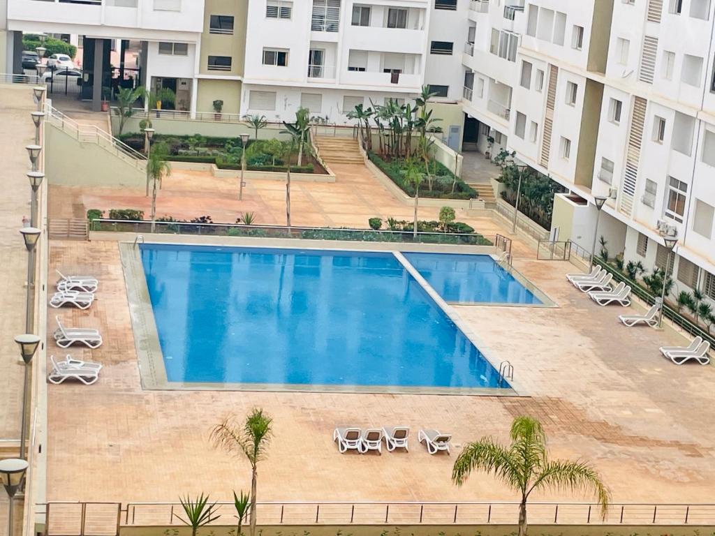 an overhead view of a swimming pool in a building at 30° apartment paradise of the sun in Agadir