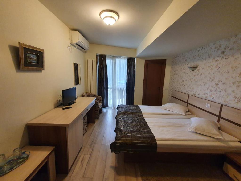 Postel nebo postele na pokoji v ubytování Hotel Stogu