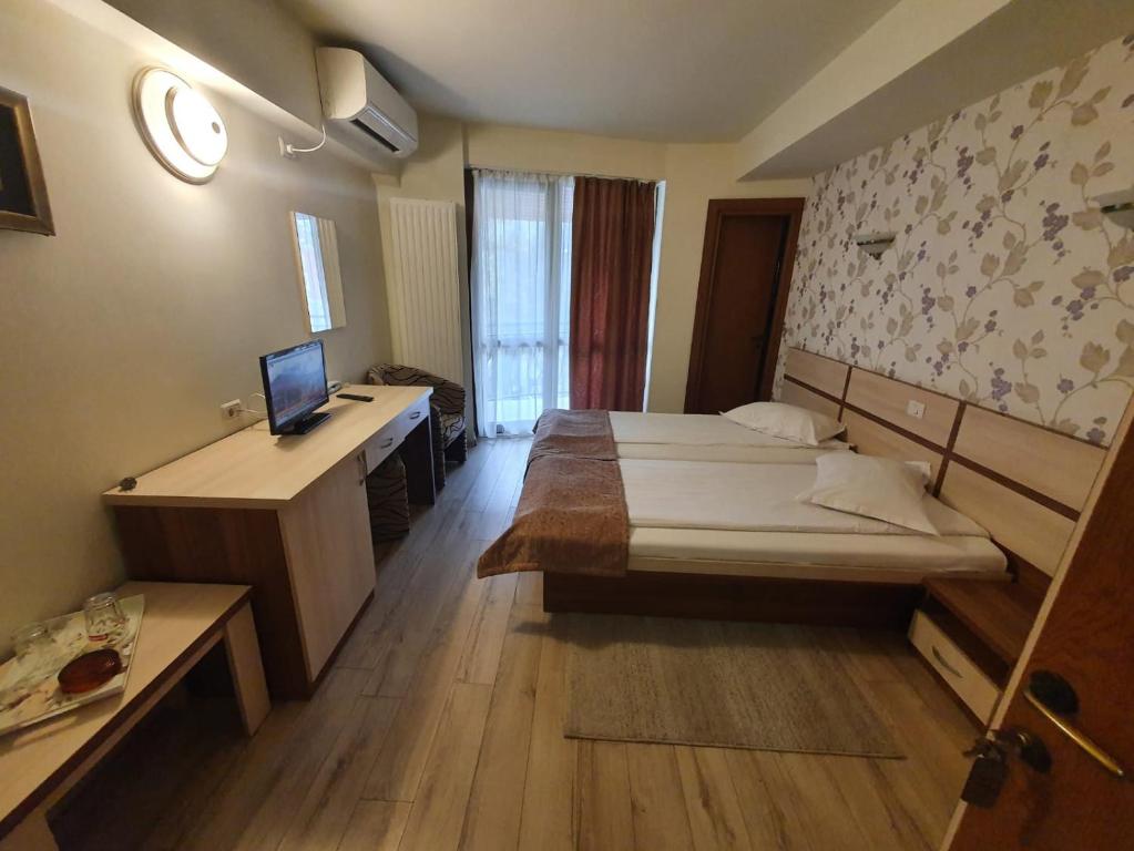 Postel nebo postele na pokoji v ubytování Hotel Stogu