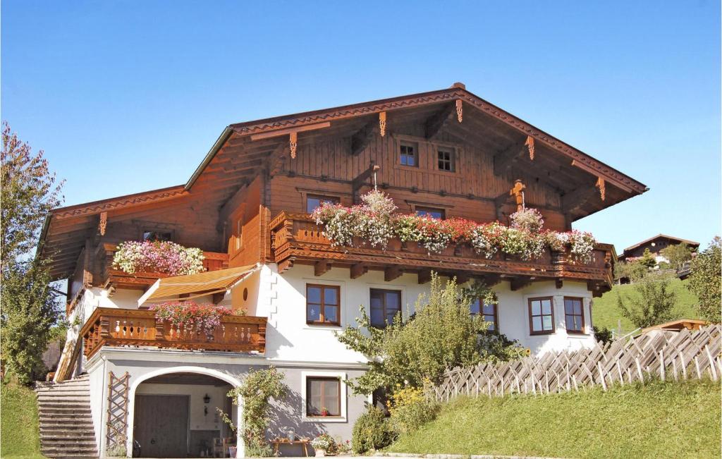 a house with flower boxes on the side of it at Awesome Apartment In Flachau With Wifi in Flachau