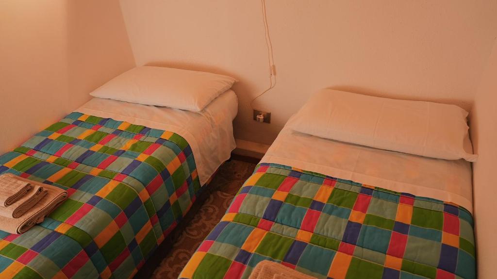 Postel nebo postele na pokoji v ubytování Accogliente Appartamento Foppolo