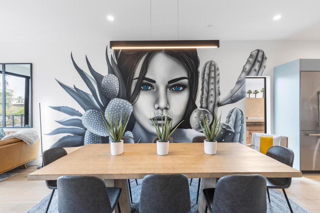 a dining room with a wall mural of a woman at Perfect Friends Escape in Old Town Scottsdale with Resort Pool Access and Roof Deck! in Scottsdale