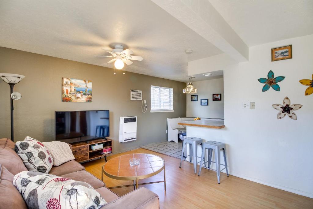 a living room with a couch and a table at Charming Albuquerque Apartment Near Old Town! in Albuquerque