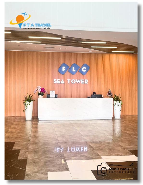 a sea tower lobby with a sign on the wall at FLC Luxury Apartment Quy Nhon in Quy Nhon