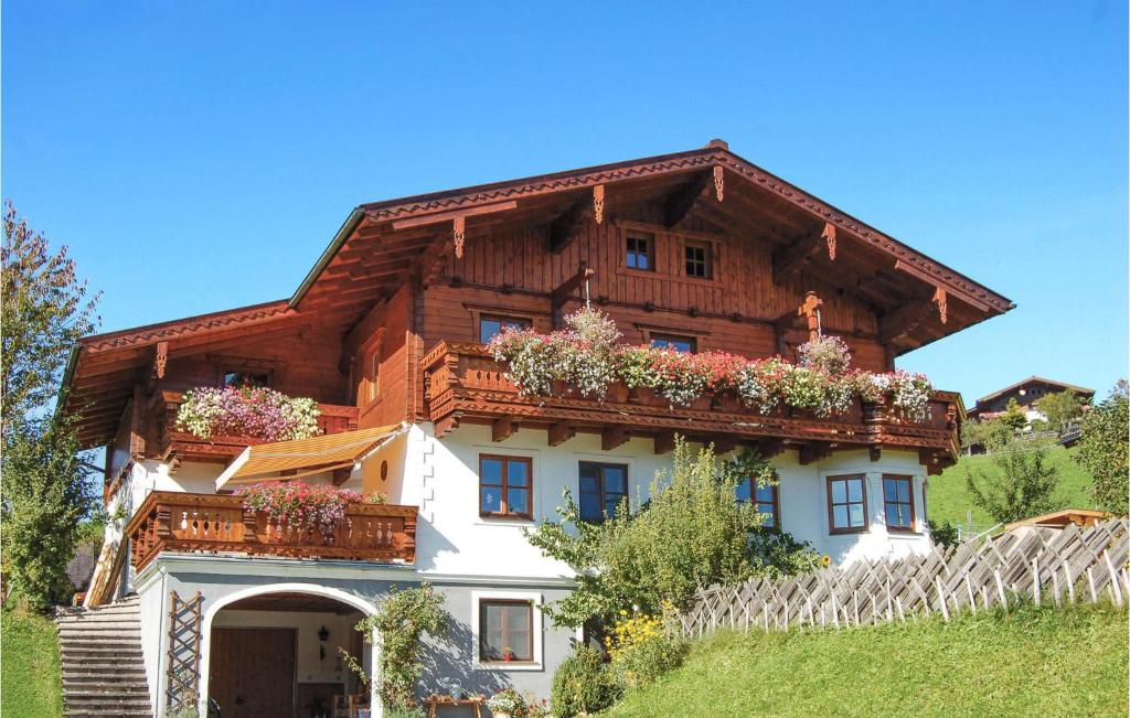 a house with flower boxes on the side of it at Awesome Apartment In Flachau With 2 Bedrooms And Wifi in Flachau