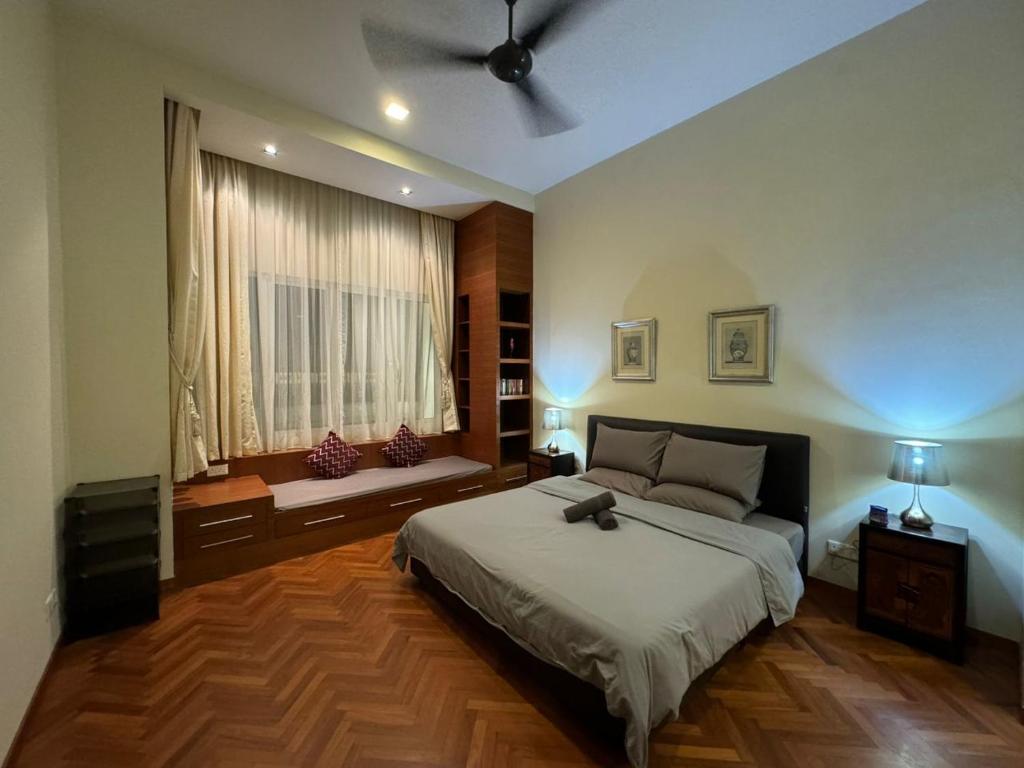 a bedroom with a large bed and a window at Perfect Marina @ Strait Quay /w Exclusive Stay in Tanjong Tokong