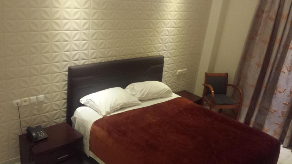 Postel nebo postele na pokoji v ubytování Hotel Ermis
