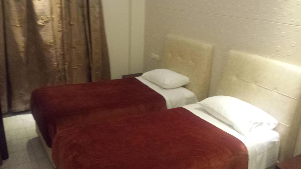 Postel nebo postele na pokoji v ubytování Hotel Ermis