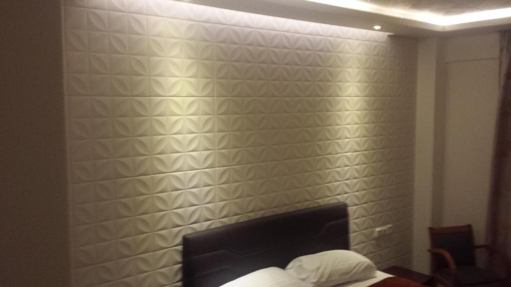 Postel nebo postele na pokoji v ubytování Hotel Ermis