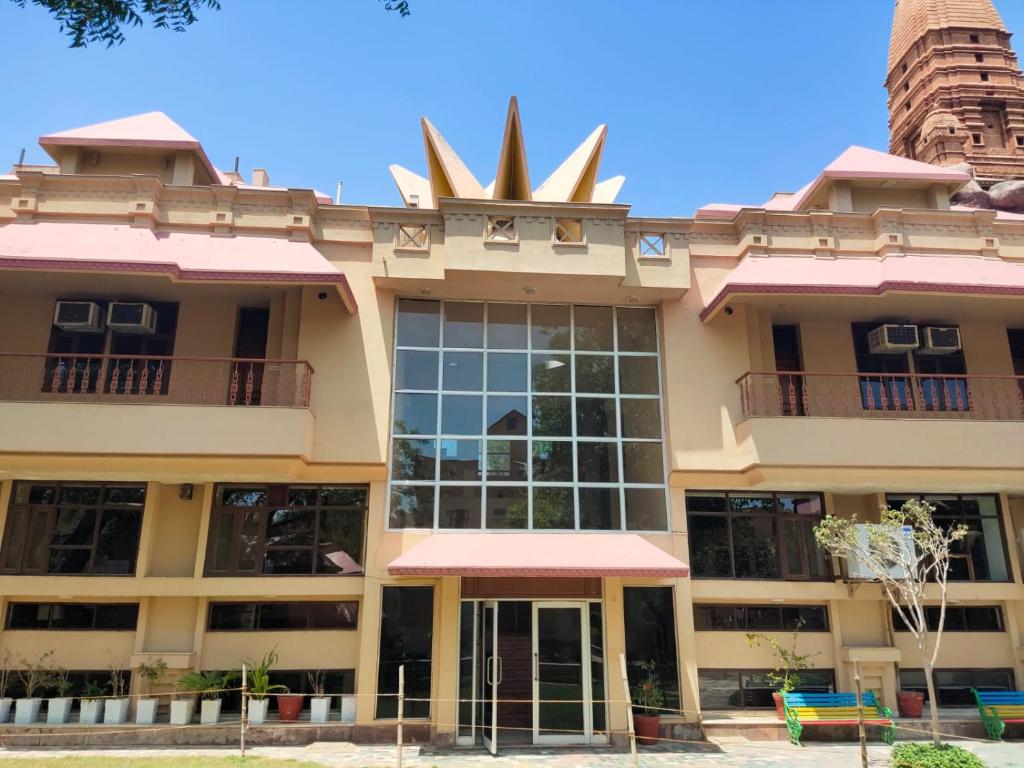 a building with a pineapple on the top of it at Ananda Krishna Van in Vrindāvan