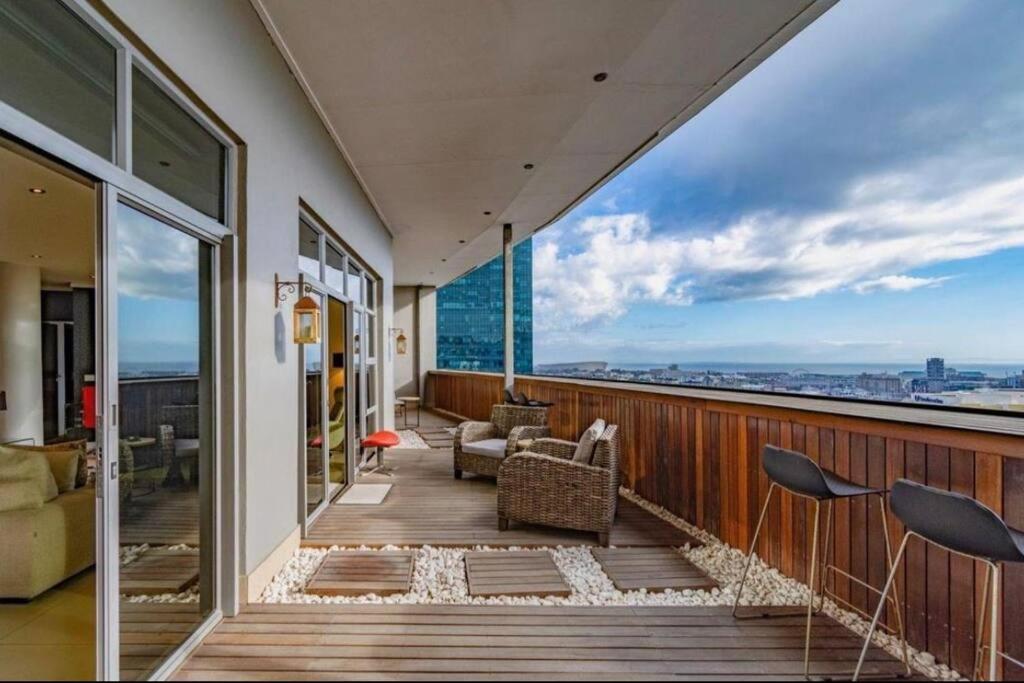 a balcony with a view of the city at ICON Living in Cape Town