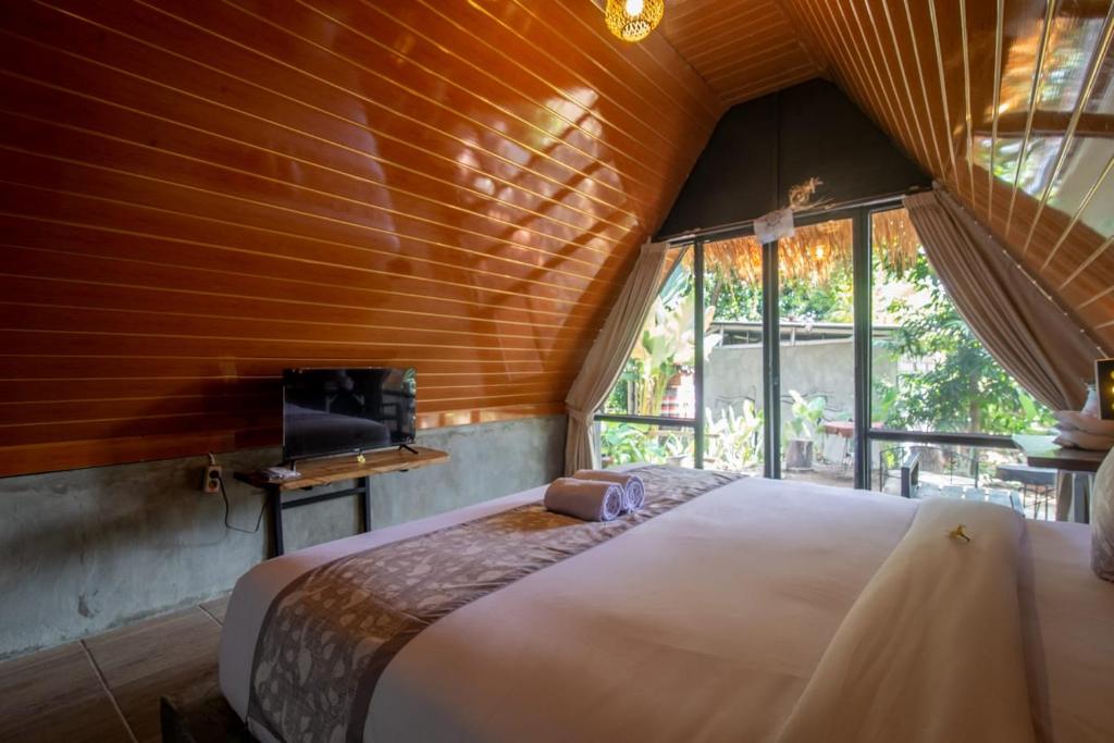 Postel nebo postele na pokoji v ubytování Mangoforest Bali