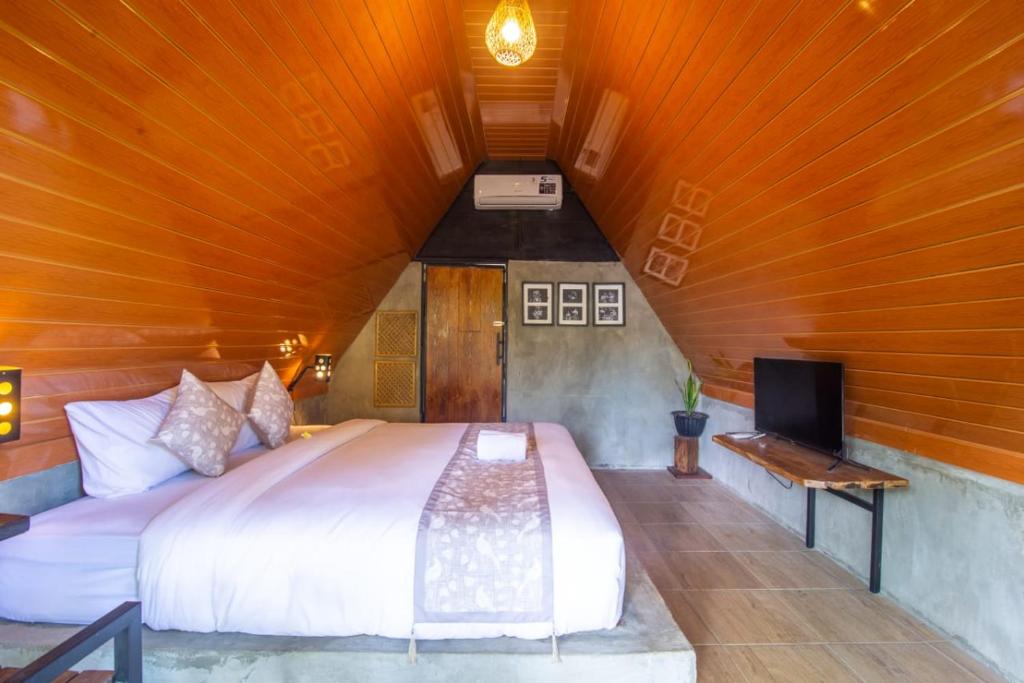 Postel nebo postele na pokoji v ubytování Mangoforest Bali