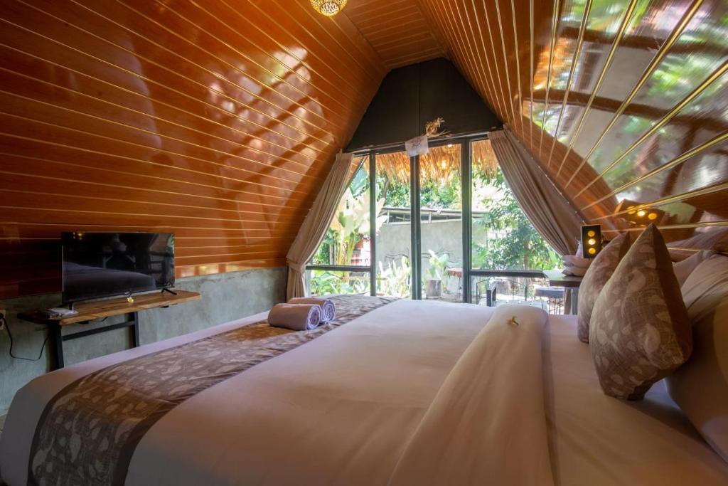 Postel nebo postele na pokoji v ubytování Mangoforest Bali
