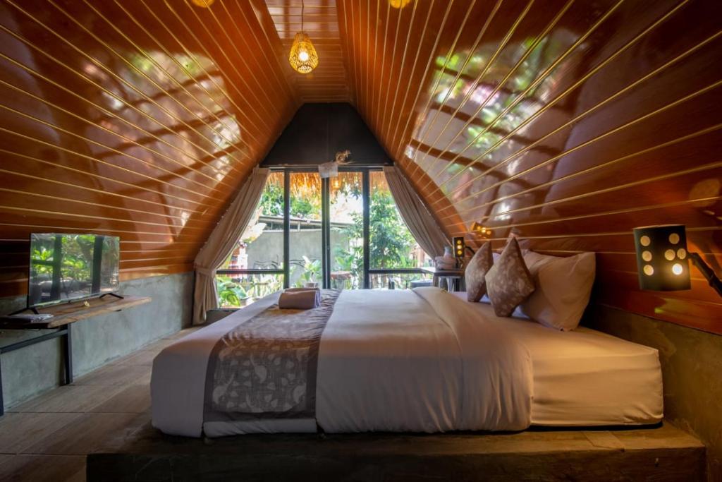 Postel nebo postele na pokoji v ubytování Mangoforest Bali