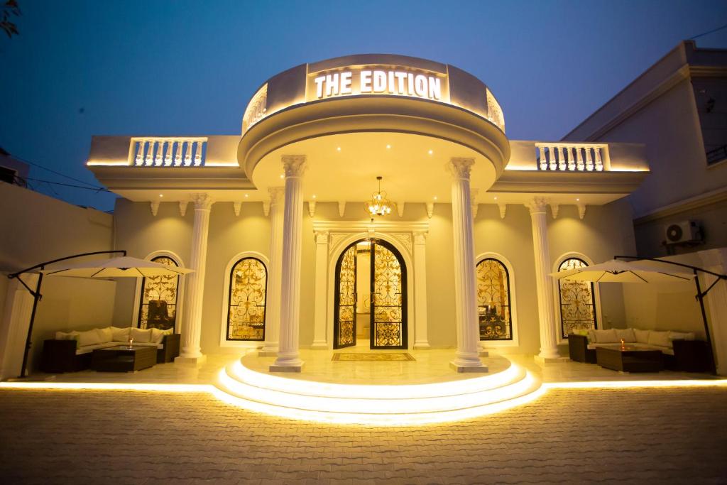 a building with a sign that says the button at The Edition Bahawalpur in Bahawalpur