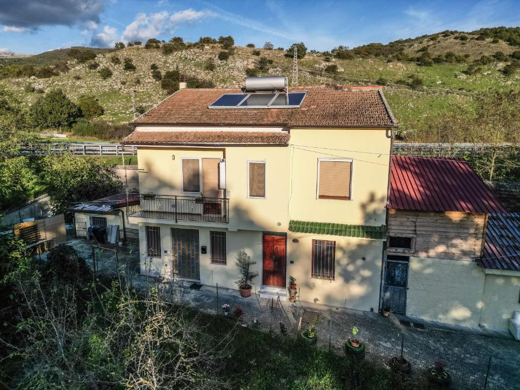 a house with a solar panel on top of it at La Vecchia Cascina in Atena Lucana