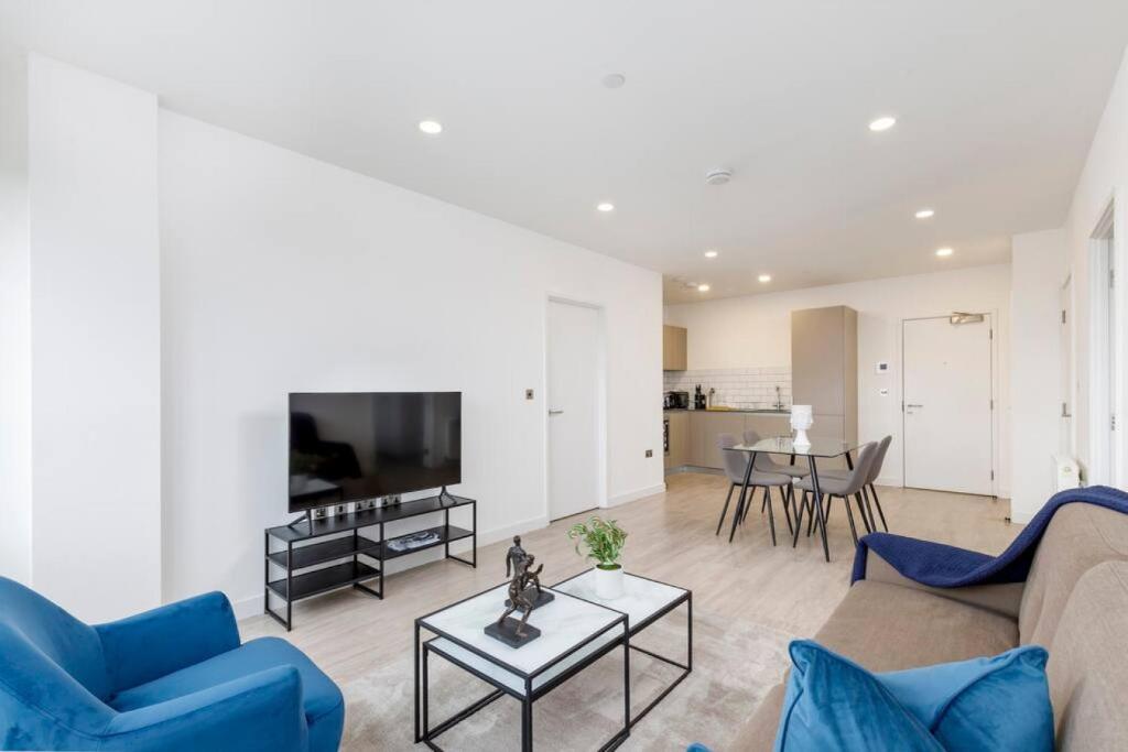 a living room with a couch and a table at Central 2BR Urban Haven Rooftop Terrace in Bracknell