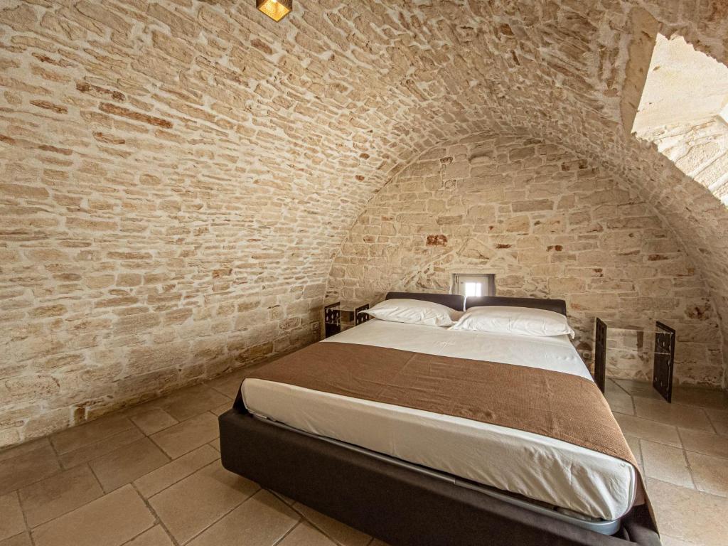 Cama o camas de una habitación en Martine Dimore Storiche di Puglia