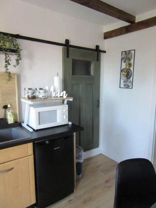 Kuchyň nebo kuchyňský kout v ubytování Komplett ausgestattetes Apartment , Ebbe und Flut
