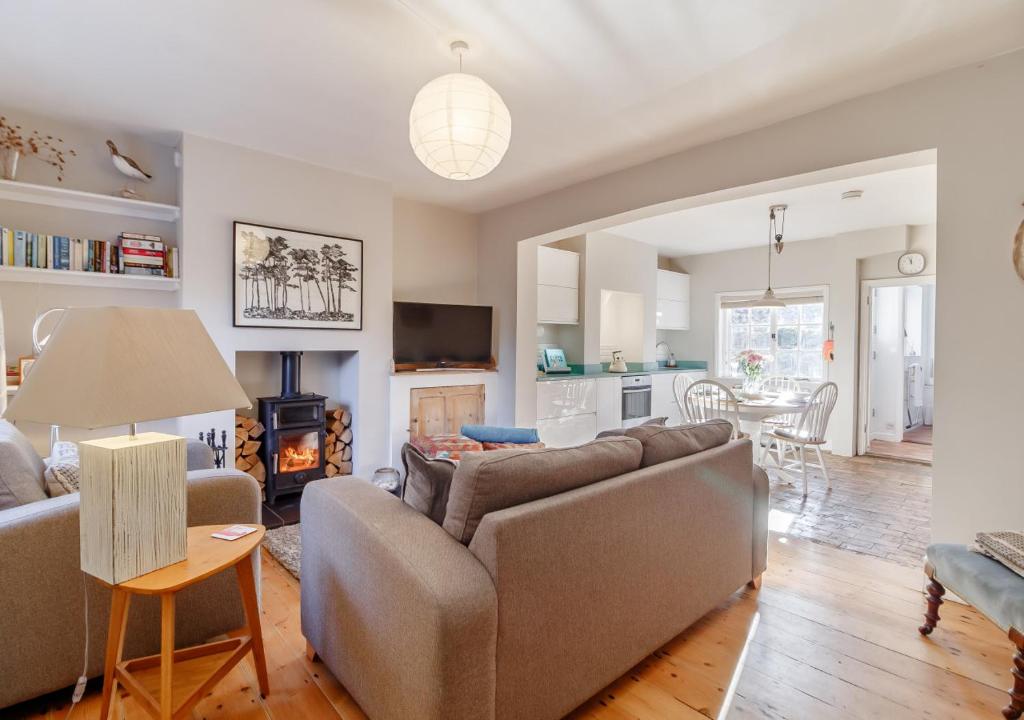 a living room with a couch and a table at The Lobster Pot in Orford