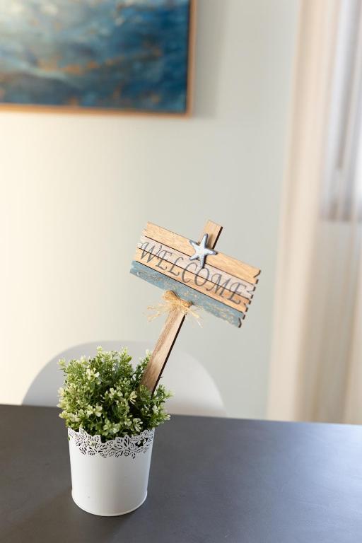 a planter with a bird sitting on top of a table at Lampetos Houses Molyvos in Mythimna