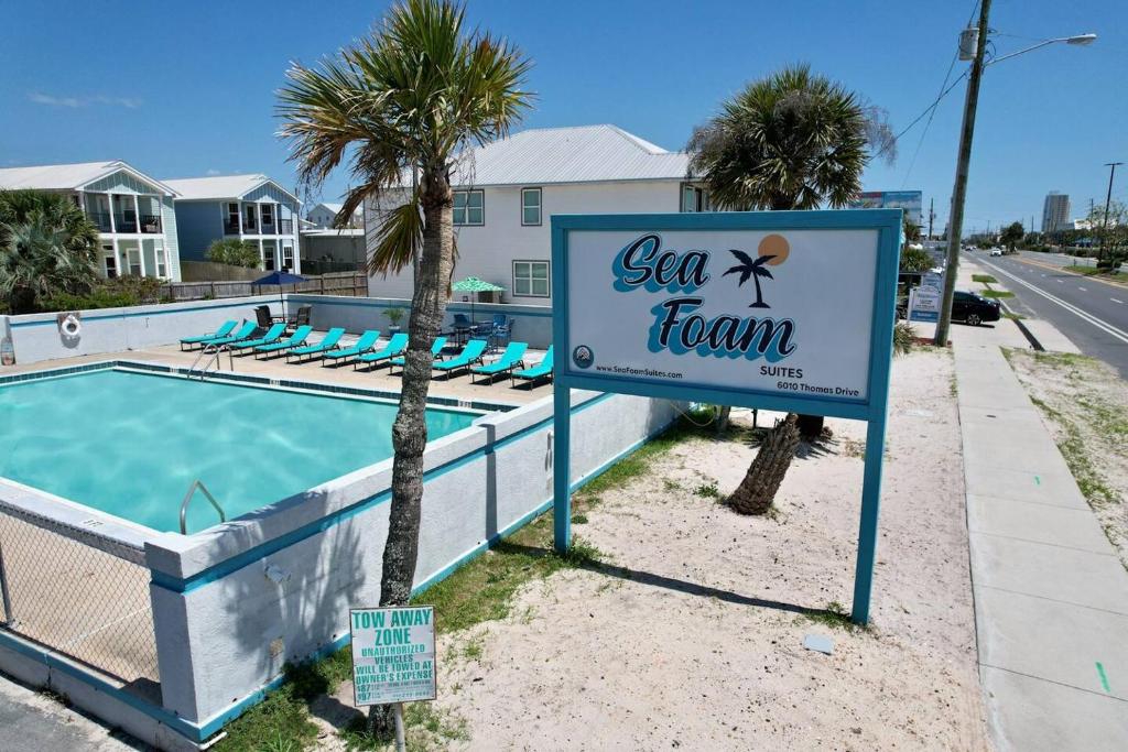 a sign for a swimming pool at a vacation inn at Sea Foam Suites in Panama City Beach