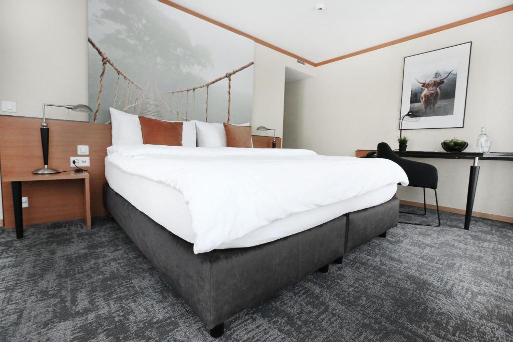 Postel nebo postele na pokoji v ubytování HOTEL ENGEL LIESTAL - Business & Lifestyle