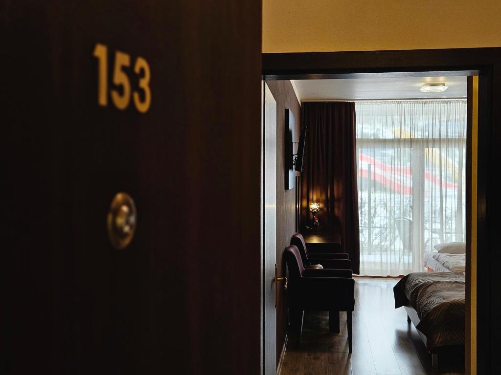 A bed or beds in a room at Apartmán Bešeňová