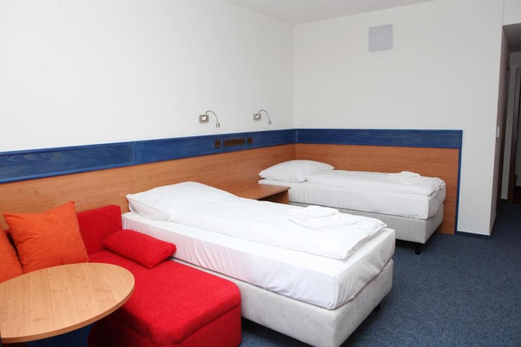 Postel nebo postele na pokoji v ubytování Hotelový dům Kaskáda - Bed and Breakfast