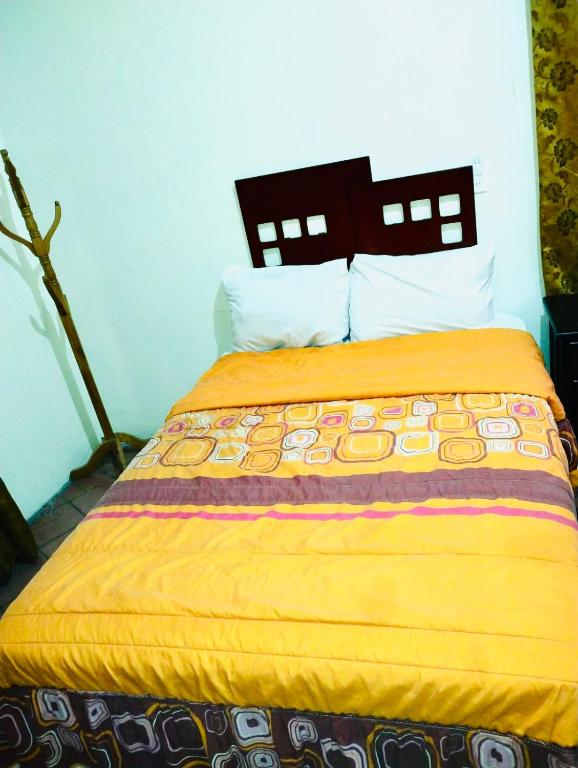 Postel nebo postele na pokoji v ubytování Hostal Santuario de las Libelulas