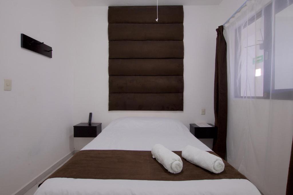 Postel nebo postele na pokoji v ubytování Hotel Villa 12 TX