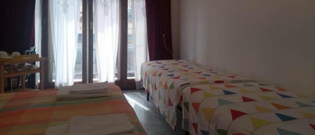 Postel nebo postele na pokoji v ubytování B&B Al Molo