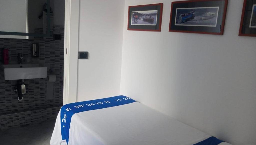 Postel nebo postele na pokoji v ubytování B&B Al Molo