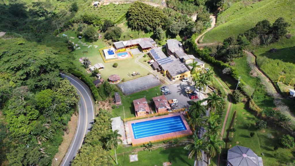an aerial view of a house with a swimming pool at Centro Integral Coodecom in Manizales