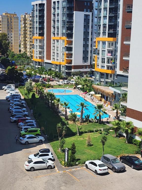 an aerial view of a parking lot with a pool at Luxury Apartment POOL SPA GYM 1+1 in Antalya