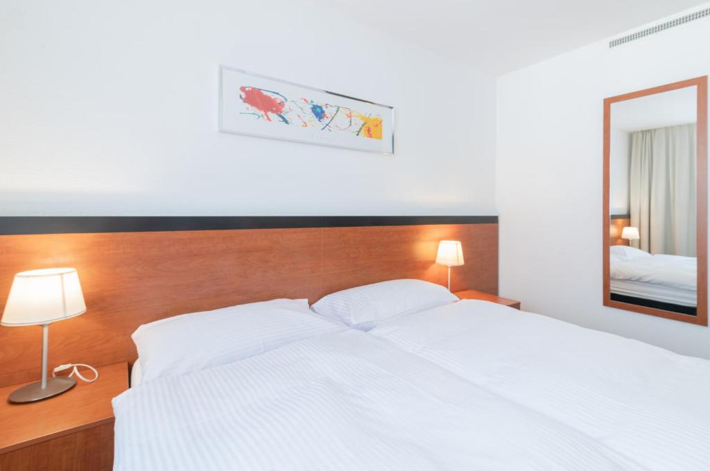 Postel nebo postele na pokoji v ubytování Motel Gottardo Sud