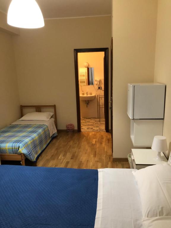 Postel nebo postele na pokoji v ubytování Moon River Guest House