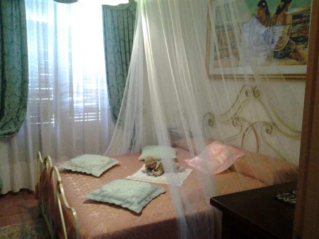 Un pat sau paturi într-o cameră la Angolo di Paradiso