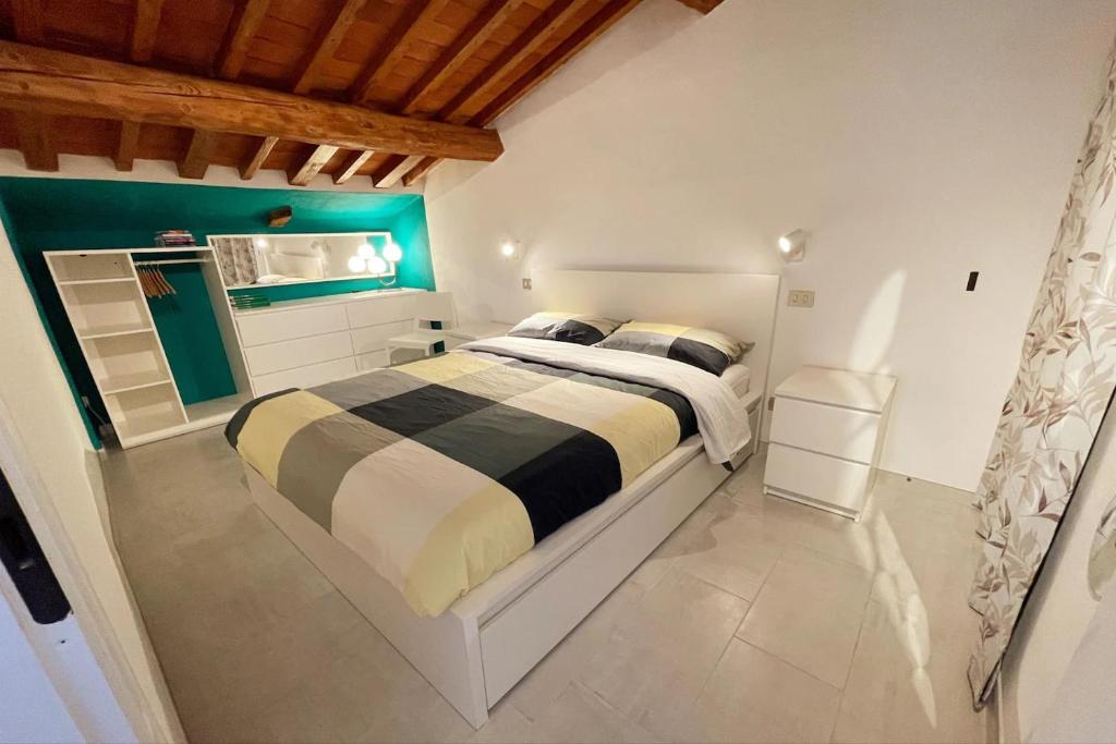 a bedroom with a large bed in a room at The Perfect Base to Explore Tuscany - Between Pisa, Lucca, and Florence! - Netflix & YouTube Premium Included in Montecatini Terme