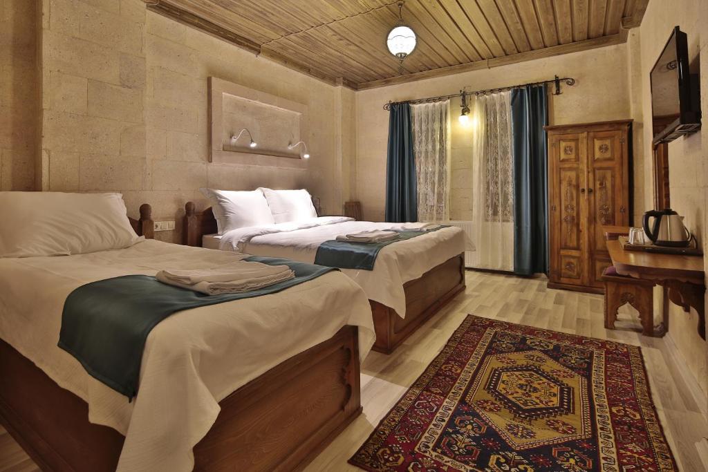 Postel nebo postele na pokoji v ubytování Cappadocia View Suit