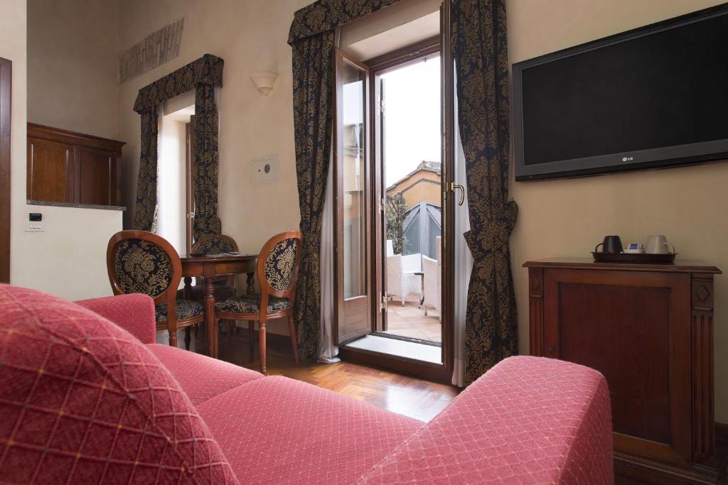 TV a/nebo společenská místnost v ubytování Hotel Teatro Pace
