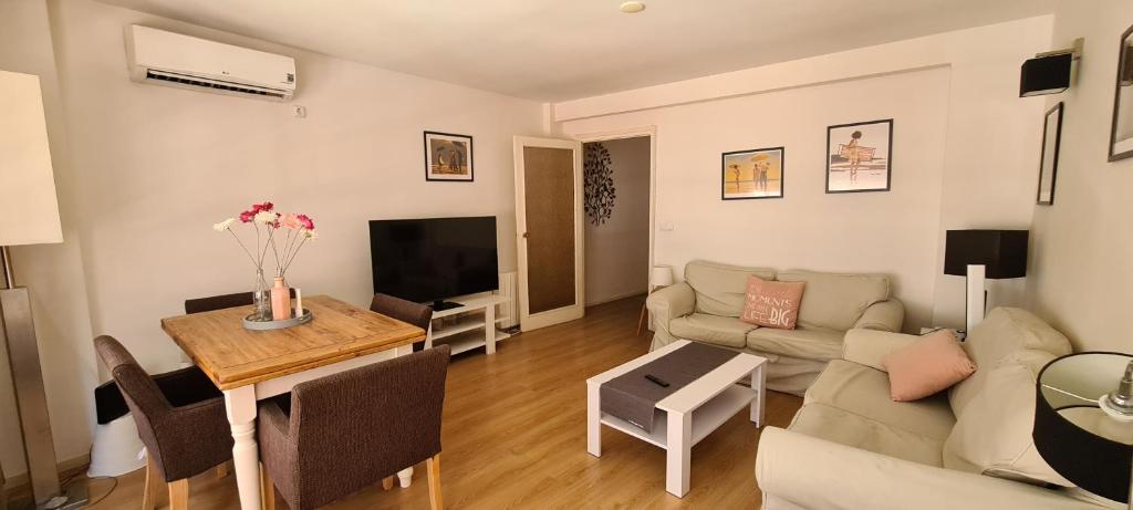 a living room with a couch and a table at Old town - Beach apartment in Benidorm