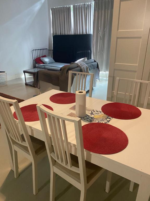 a living room with a table and chairs and a couch at Manzanas in Camarma de Esteruelas