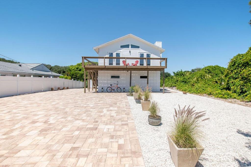 a house sitting on top of a brick driveway at Bright New Beach House with In- Law Suite -- 2 blocks to beach! in St. Augustine