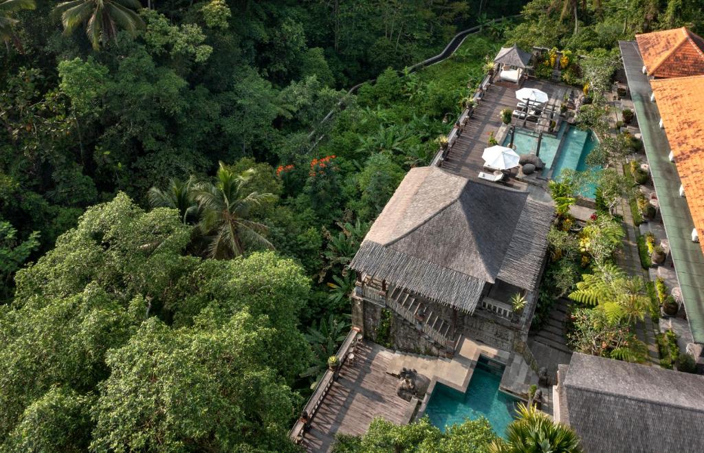 an overhead view of a house with a pool and trees at Kawi Resort A Pramana Experience in Tegalalang