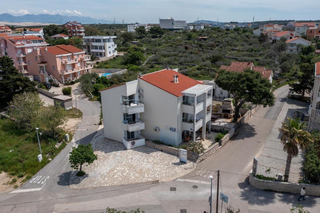 an aerial view of a building in a city at Apartments Eddy Veselica in Novalja