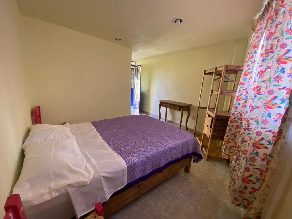 Postel nebo postele na pokoji v ubytování Casa Meraki