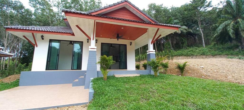 a small house with a red roof at Koh Lanta MaiKaew Villa in Ban Ru Yai