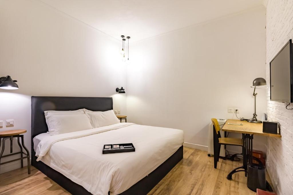 Postel nebo postele na pokoji v ubytování Yi Stack Hotel Beijing